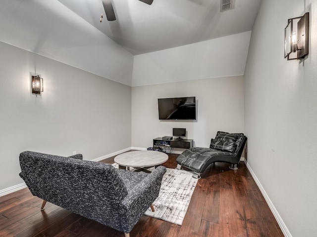 living room with ceiling fan, lofted ceiling, and dark hardwood / wood-style flooring