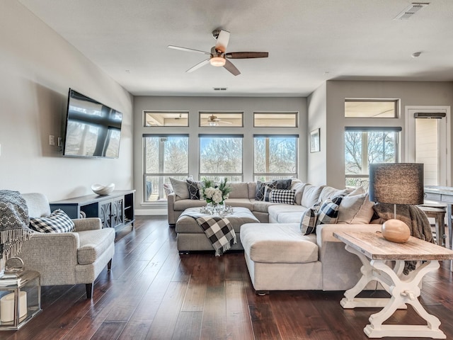 living room with ceiling fan and dark hardwood / wood-style flooring