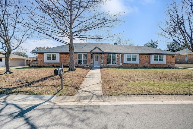 ranch-style house with a front lawn