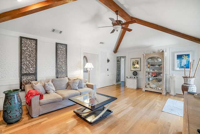 living room with lofted ceiling with beams, ceiling fan, and light hardwood / wood-style floors