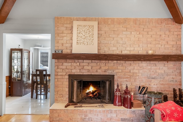 interior details with a brick fireplace