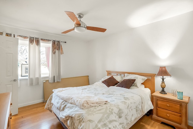 bedroom featuring light wood-type flooring and ceiling fan