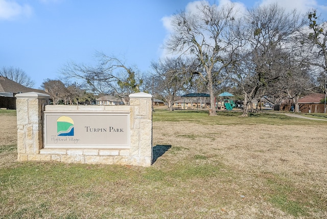 view of property's community featuring a playground and a yard