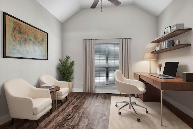 office space featuring ceiling fan, baseboards, vaulted ceiling, and dark wood-style flooring