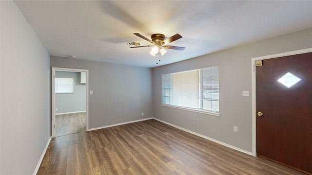 foyer with ceiling fan and dark hardwood / wood-style floors