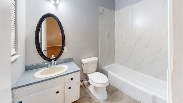 full bathroom featuring vanity, hardwood / wood-style flooring, shower / tub combination, and toilet