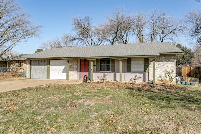 ranch-style house featuring a garage and a front yard