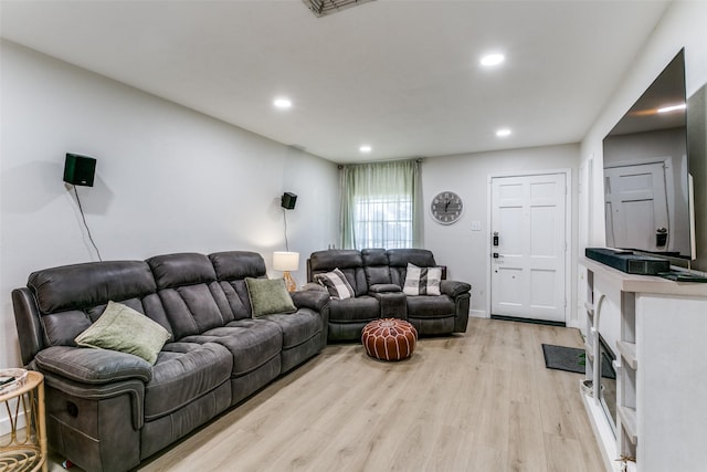 living room with light hardwood / wood-style flooring