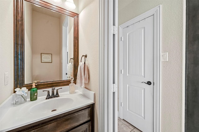 bathroom with vanity and tile patterned flooring