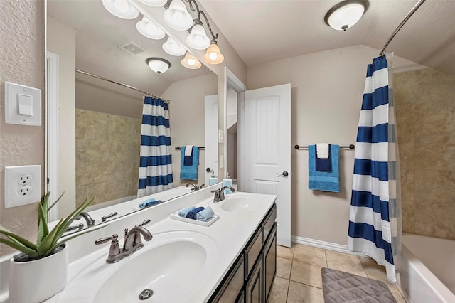 bathroom with tile patterned floors, vaulted ceiling, vanity, and shower / bath combo