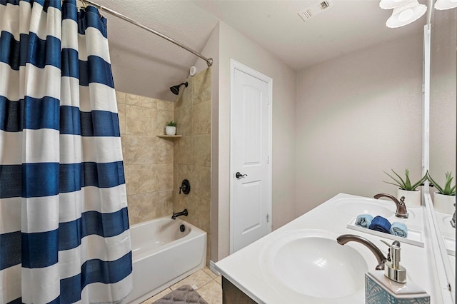 bathroom with tile patterned floors, vanity, and shower / bathtub combination with curtain