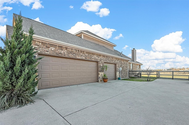 view of side of property featuring a garage