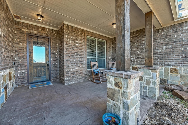 doorway to property featuring a porch