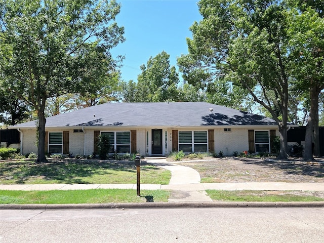 ranch-style house with a front lawn