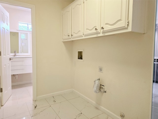 washroom with cabinets, hookup for a washing machine, and electric dryer hookup