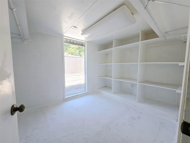 unfurnished room with concrete floors