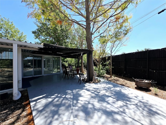 view of patio / terrace featuring a fire pit