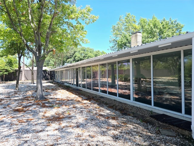 view of side of property with a sunroom