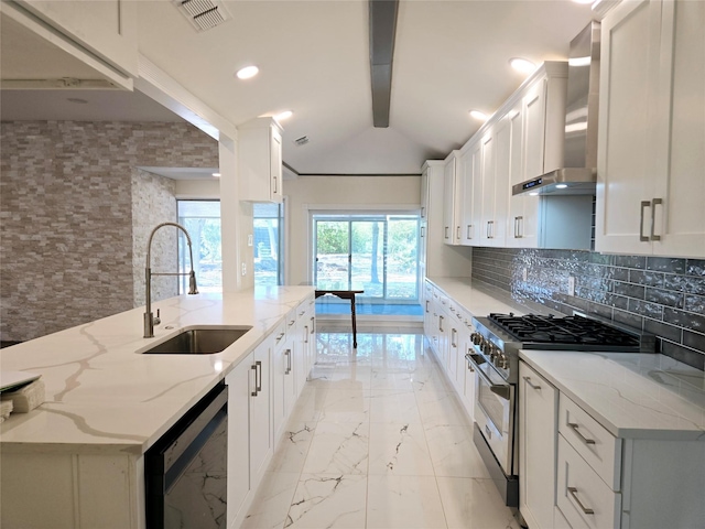 kitchen featuring stainless steel stove, white cabinetry, and light stone counters