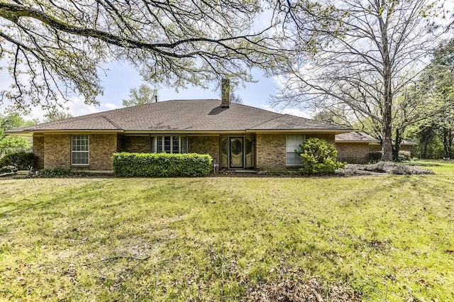 single story home with a front lawn and a chimney