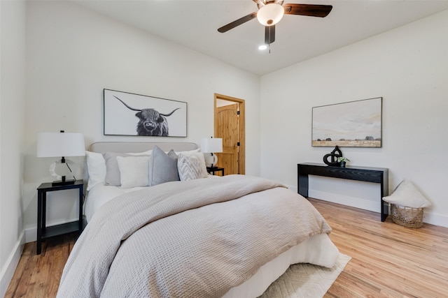 bedroom featuring wood-type flooring and ceiling fan