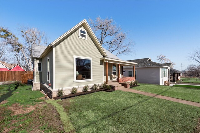 view of front facade featuring covered porch and a front lawn