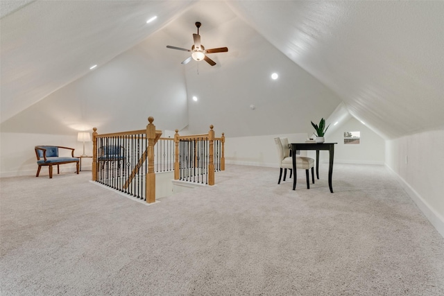 additional living space with vaulted ceiling, light carpet, and ceiling fan