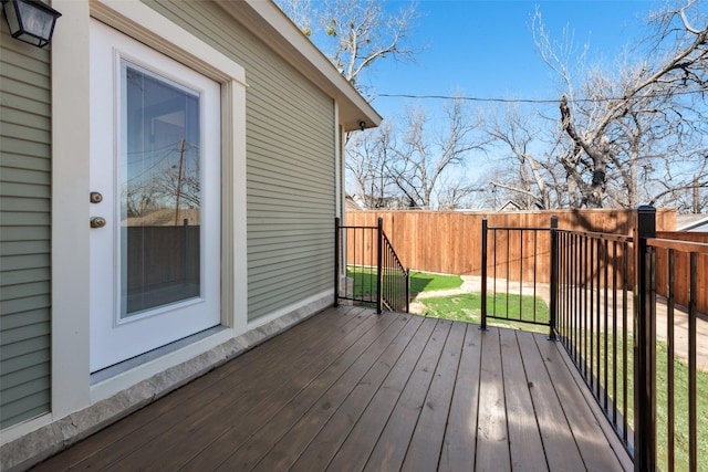 wooden terrace with a lawn