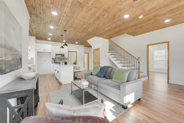 living room with light hardwood / wood-style flooring and wooden ceiling