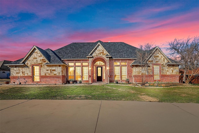 view of front of home with a yard