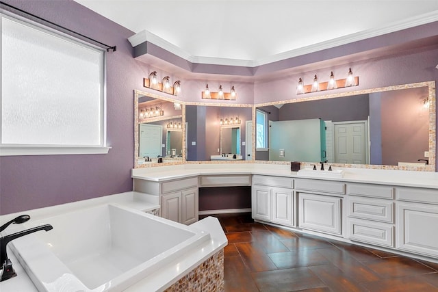 bathroom with a washtub, vanity, ornamental molding, and tile patterned flooring