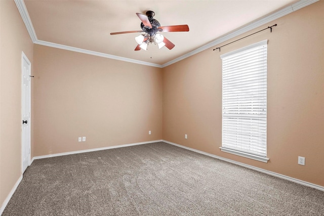 carpeted spare room featuring ceiling fan and ornamental molding