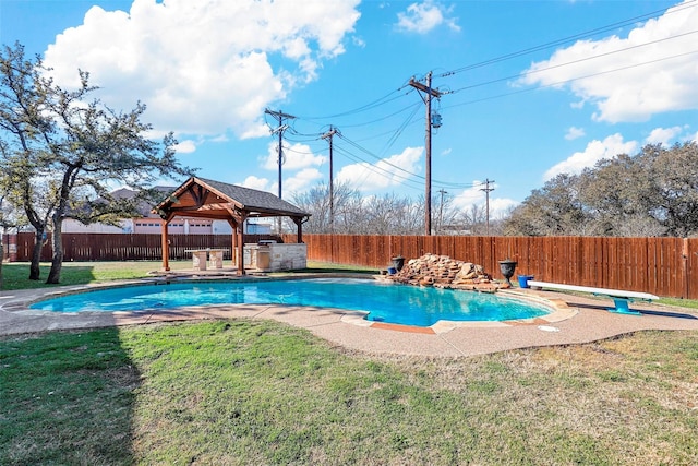 view of pool with a diving board, a gazebo, and a yard