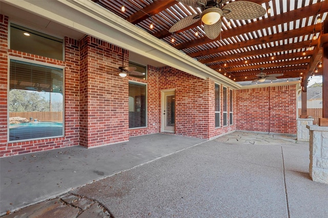 view of patio / terrace with ceiling fan and a pergola