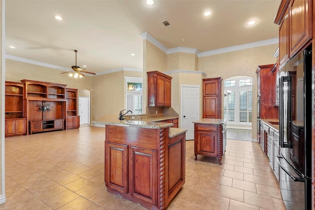 kitchen featuring sink, kitchen peninsula, ceiling fan, light tile patterned floors, and high end black refrigerator