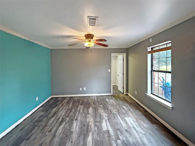 spare room with crown molding, wood-type flooring, and ceiling fan