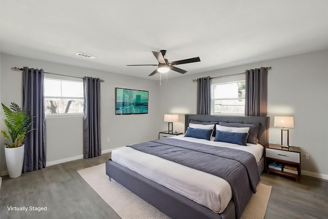 bedroom featuring ceiling fan and dark hardwood / wood-style floors