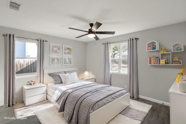 bedroom featuring ceiling fan and dark hardwood / wood-style floors