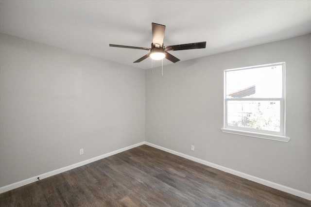 unfurnished room featuring ceiling fan and dark hardwood / wood-style flooring