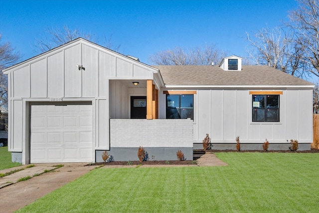 view of front of home with a garage and a front yard