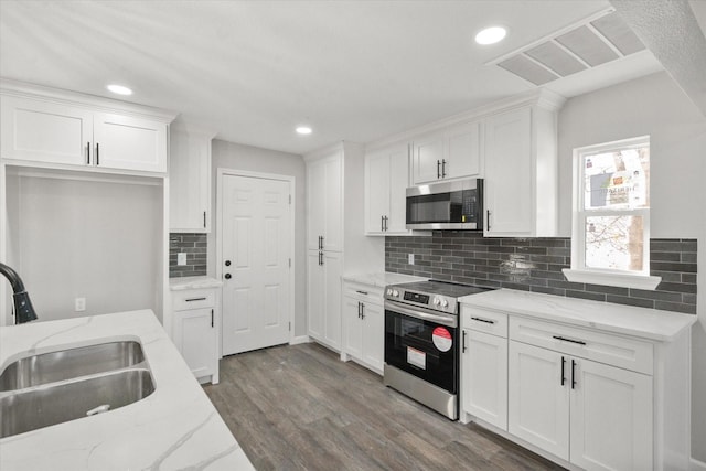 kitchen with sink, white cabinets, and stainless steel appliances