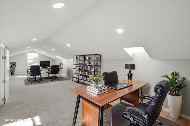 office featuring light colored carpet and vaulted ceiling