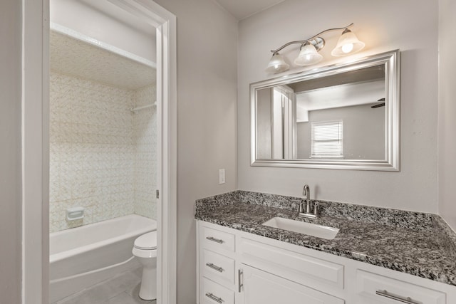 full bathroom with tile patterned floors, toilet, vanity, and tiled shower / bath combo