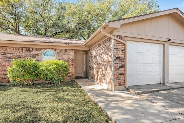 doorway to property with a yard