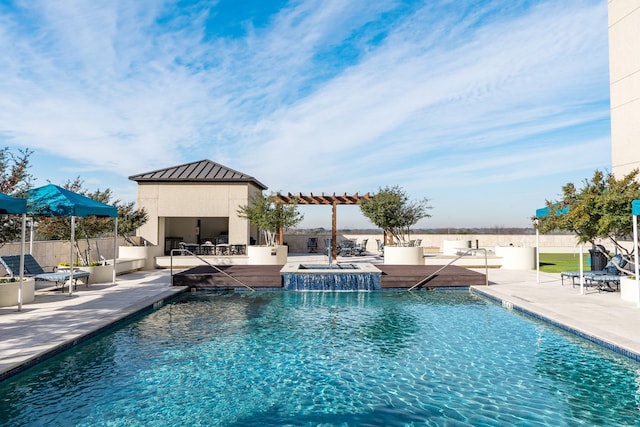 view of swimming pool with a patio, a jacuzzi, and a pergola