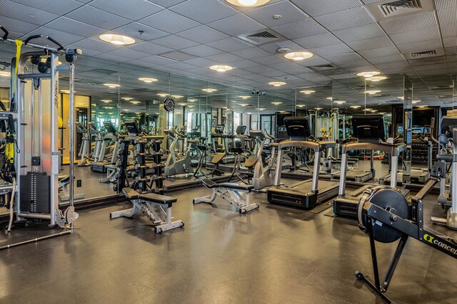 gym featuring a paneled ceiling