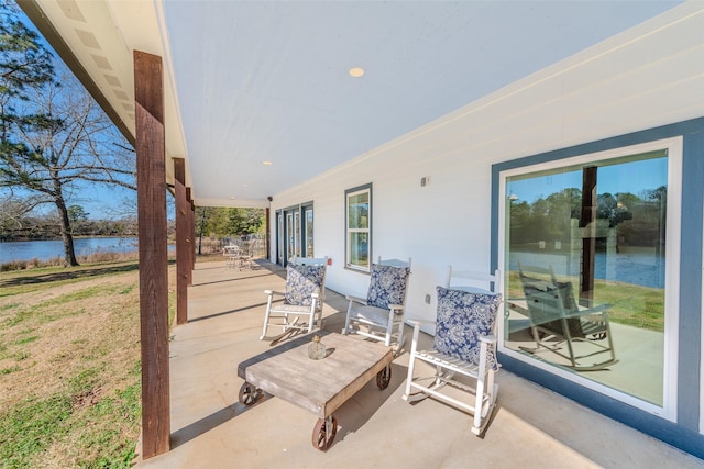 view of patio / terrace with a water view