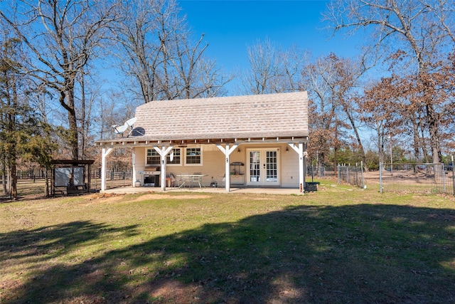 rear view of house featuring a patio, a yard, french doors, and a gazebo