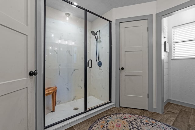 bathroom featuring hardwood / wood-style floors and walk in shower