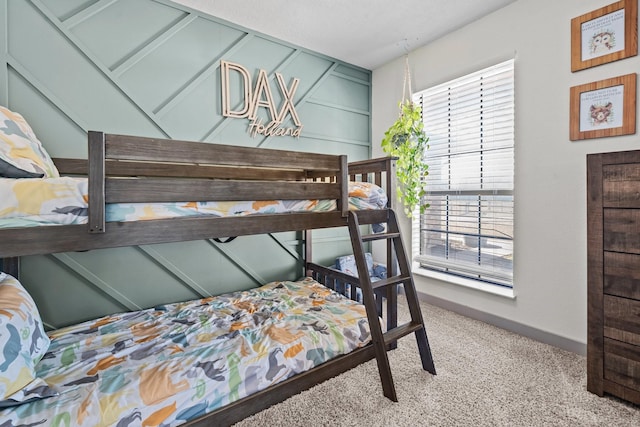 bedroom with multiple windows and light colored carpet